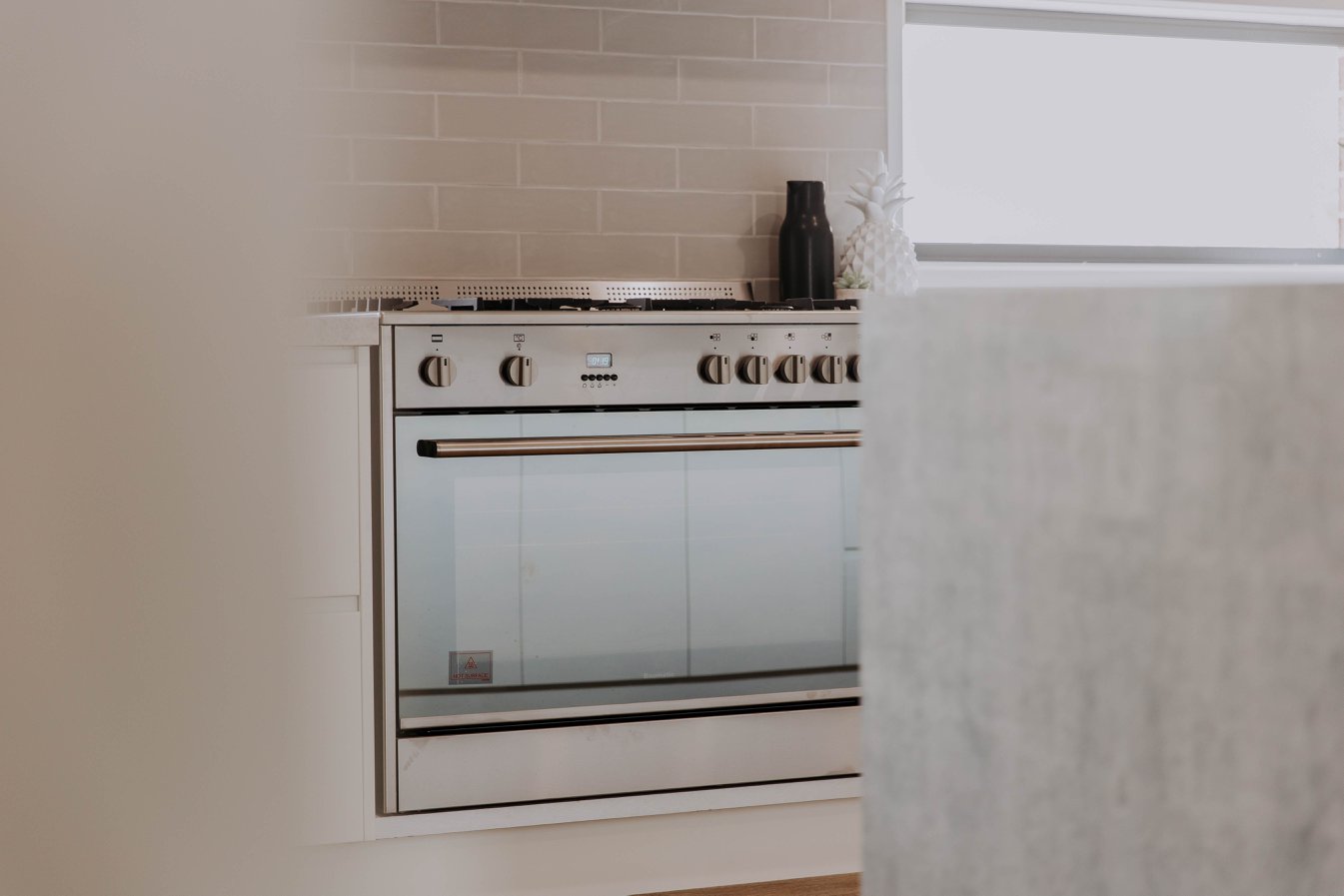 021 Alatalo Bros - kitchen - display home - cook top - kitchen design - oven - custom homes - kitchen cabinet design - cabinets - interior design - homes - builders - display home